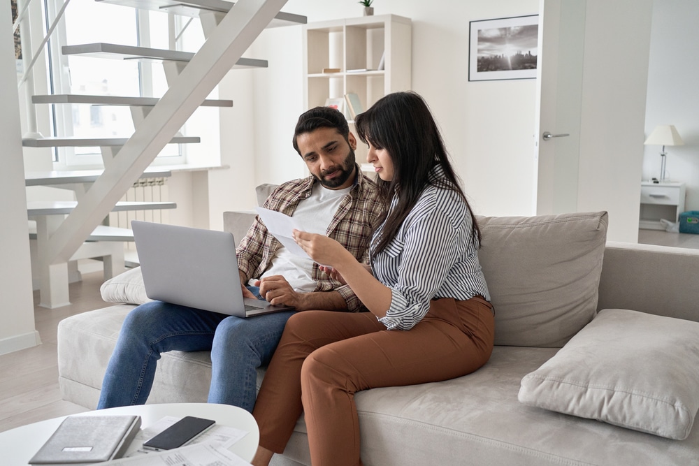 Happy homeworkers looking over paperwork