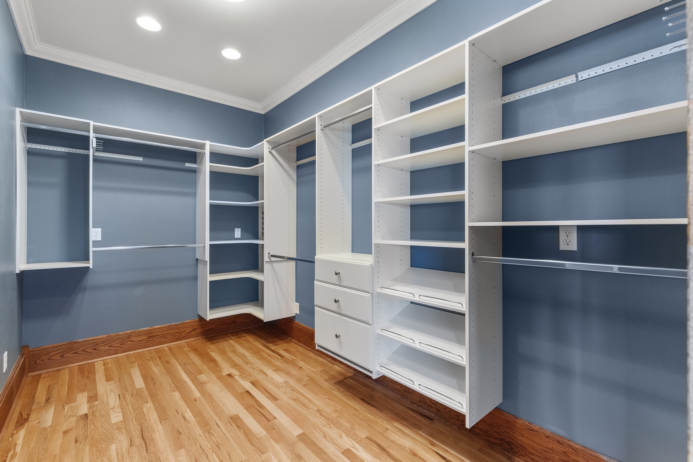 Nice white wood shelving in walk-in closet