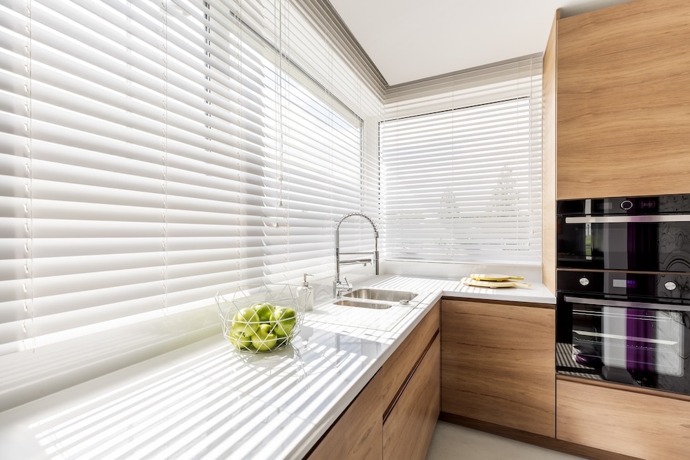Beautiful white shutters in modern kitchen