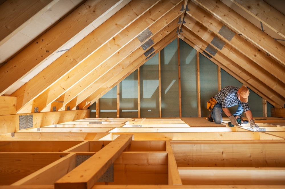 Builder working in attic